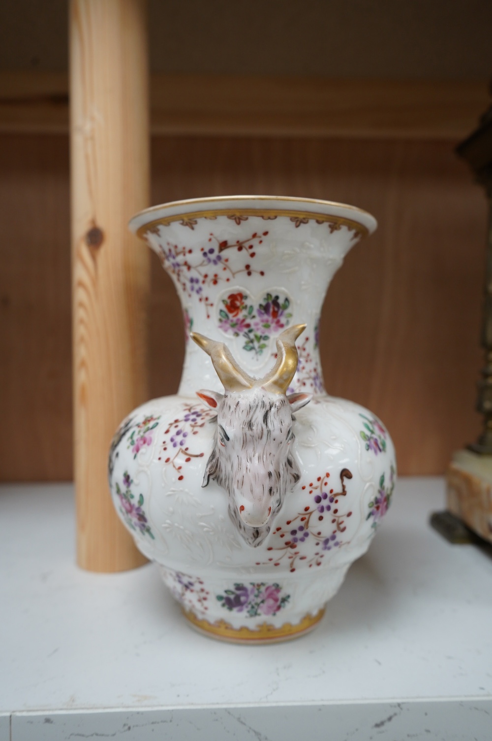 A Samson armorial porcelain vase with ram's head handles, 17cm high. Condition - good